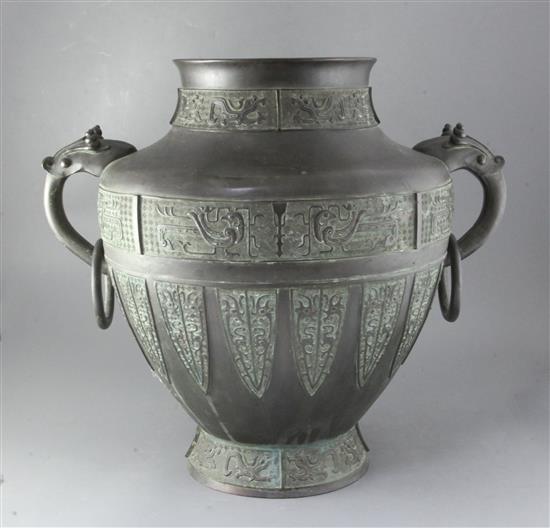 A large Chinese or Japanese archaistic bronze jardiniere, 19th century, height 53cm